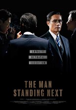 the-man-standing-next